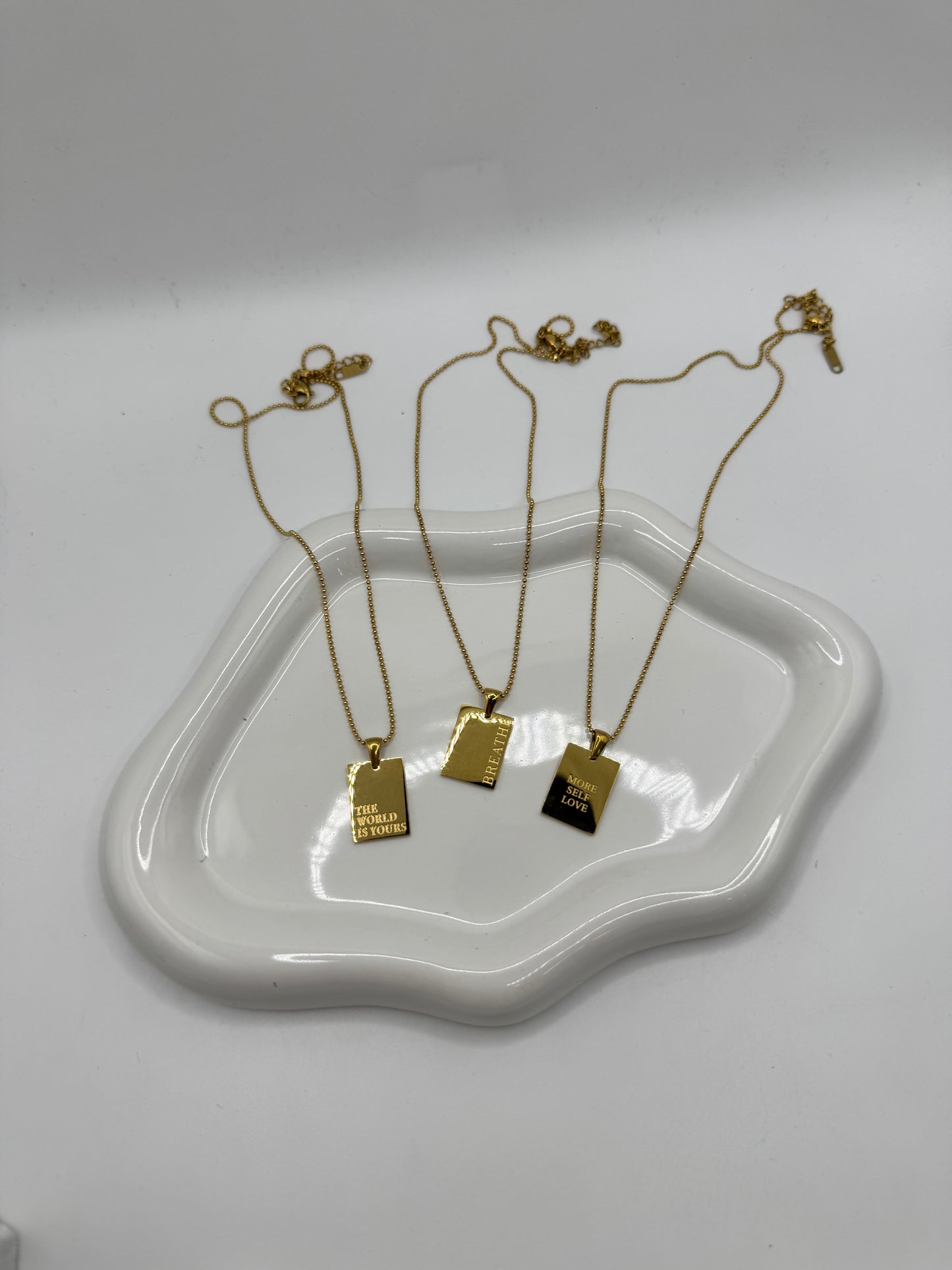 Collana placchetta con frase