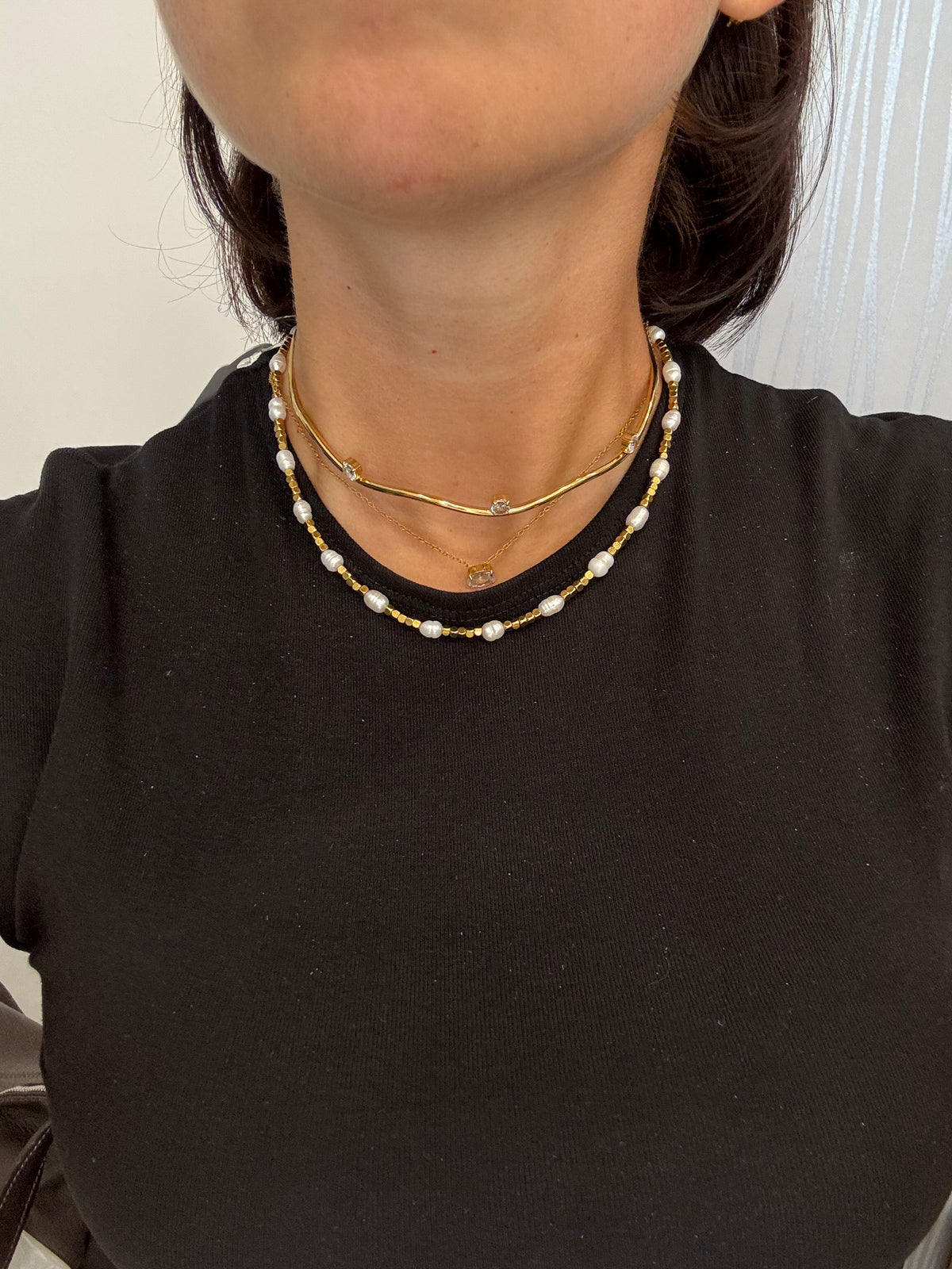 Collier rigido onda punti luce